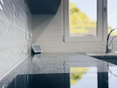a kitchen counter with a sink and a window at A Casa Elena - Modern Family home in Praia da Luz in Luz