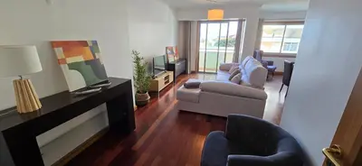 a living room with chairs and a tv and a couch at A Dream on the Cliff in Funchal