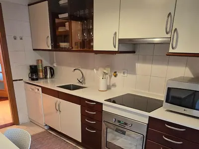 a kitchen with a sink and a microwave at A Dream on the Cliff in Funchal