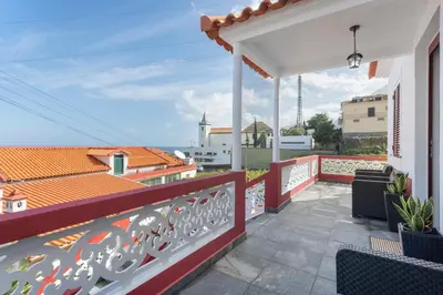 a balcony with a view of a building at Casa Da Avó Ferreirinha in Seixal