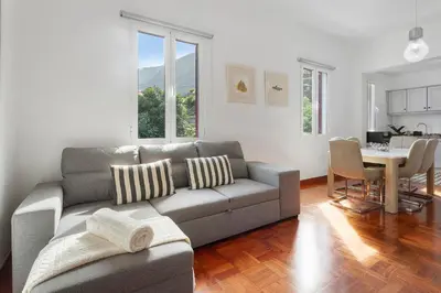 a living room with a couch and a table at Casa Da Avó Ferreirinha in Seixal