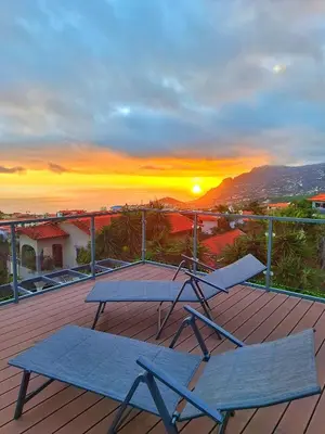 two beds sitting next to each other in a room at Skyline Home Funchal in Funchal