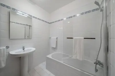 a bathroom with a tub and a sink and a shower at Casa da Fajã Alta in São Jorge