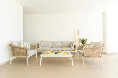 a living room with a couch and chairs and a table at Acqua Beach by Atlantic Holiday in Panasqueira