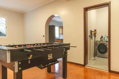 a pool table in the middle of a room at Villa Alves by Altlantic Holiday in Faial