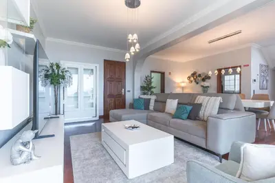 a living room with a couch and a table at Villa Alves by Altlantic Holiday in Faial