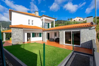 a view of a house with a yard at Villa Mirage - by Madeira To Stay in Arco da Calheta