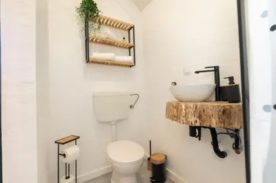 a bathroom with a toilet and a sink at Casa Serafina by Rent-a-key in Santa Maria Madalena