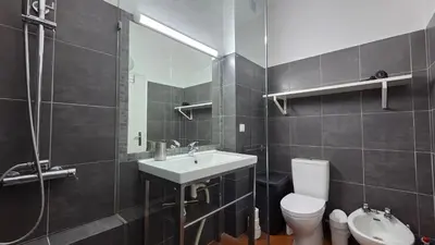 a bathroom with a sink and a toilet and a shower at Margarida Seaview Terrace Apartment in Luz