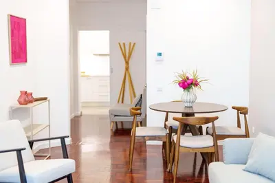 a living room with a table and chairs at Carmo Downtown Apartment by Amazing Madeira in Funchal