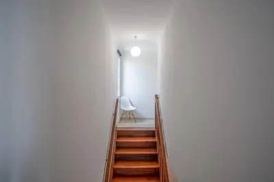 a bedroom with two beds and a balcony at Villa Alegra Paul do Mar in Paul do Mar