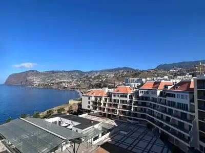 a view of a city and the water at Ocean Sea View Apartment in Funchal