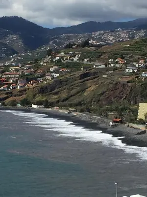 a view of a beach with houses on a hill at Ocean Sea View Apartment in Funchal