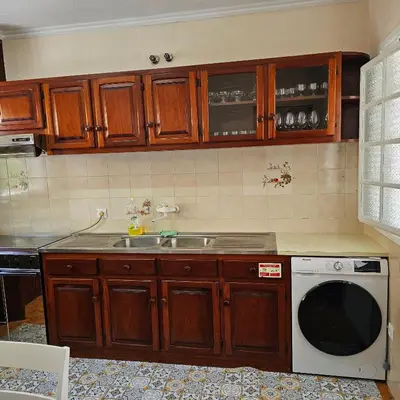 a kitchen with a sink and a microwave at JoLi Larano - APT with 3 bedroom and 2 wc in Machico