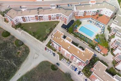 an overhead view of a building with a pool and a bridge at Beachside oasis with Pool in Luz