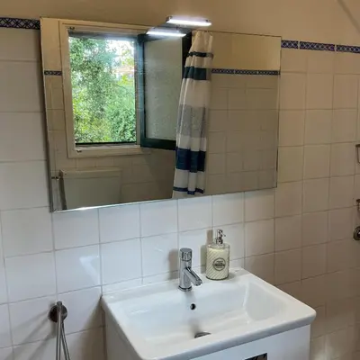 a bathroom with a sink and a mirror at Casa Žerotín in Funchal