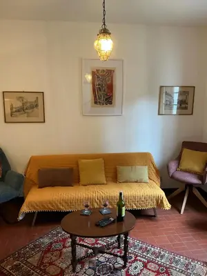 a living room with a couch and a table at Casa Žerotín in Funchal