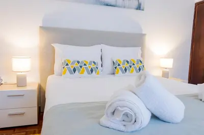a bedroom with a bed with a towel on it at Peaceful Panorama by YOUR KEY MADEIRA in Porto Moniz