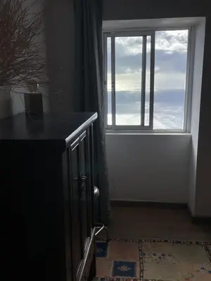 a window in a room with a view of the ocean at Ocean Retreat in Fajã da Ovelha