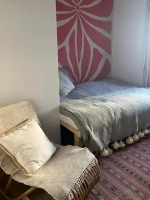 a bedroom with a bed and a mirror at Ocean Retreat in Fajã da Ovelha