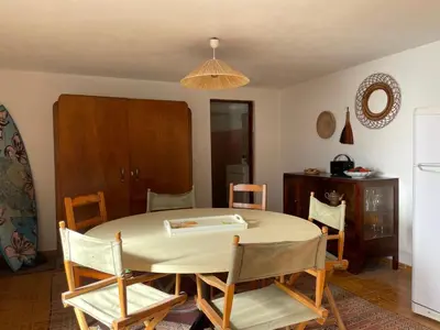a dining room with a table and chairs at Ocean Retreat in Fajã da Ovelha