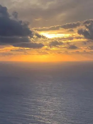 an image of a sunset over the ocean at Ocean Retreat in Fajã da Ovelha