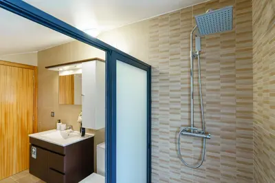 a bathroom with a shower and a sink at Casa Fontes in Canhas