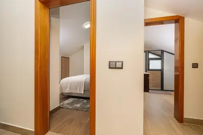 a bedroom with a door leading into a bedroom with a bed at Casa Fontes in Canhas