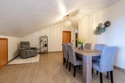 a dining room with a table and chairs at Casa Fontes in Canhas
