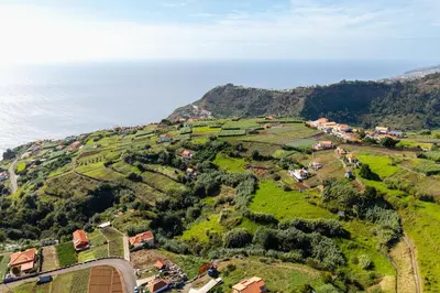 an aerial view of a village on a hill next to the ocean at Casa Fontes in Canhas