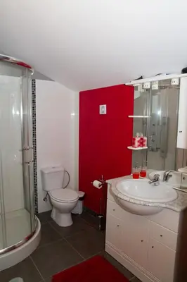 a bathroom with a toilet and a sink and a shower at Lovely place for an excellent vacation in Arco da Calheta