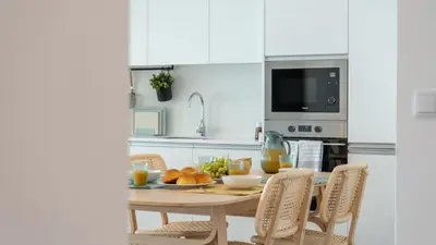 a kitchen with a table with a plate of food at Casa do Xano I by LovelyStay in Câmara de Lobos