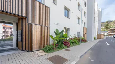 a building with plants on the side of a street at Casa do Xano I by LovelyStay in Câmara de Lobos