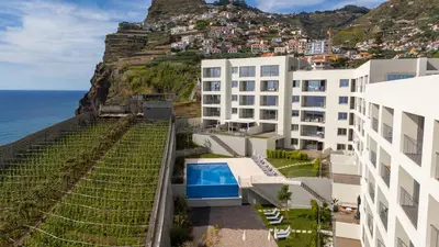 a building with a view of the ocean at Casa do Xano I by LovelyStay in Câmara de Lobos