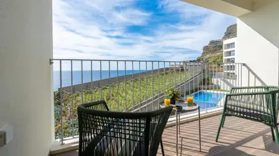 a balcony with a view of the ocean at Casa do Xano I by LovelyStay in Câmara de Lobos