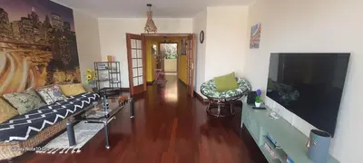 a living room with a couch and a flat screen tv at Varandas do Funchal Apartment in Funchal