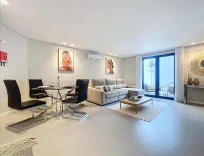 a living room with a couch and a table at Ninho Memory in Funchal