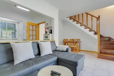 a living room with a couch and a table at Villa Holiday Sun by Holiday Rental Madeira in Ponta do Sol