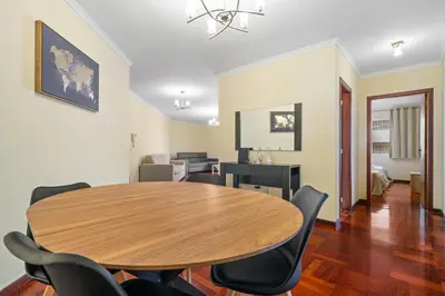 a dining room with a wooden table and chairs at Famoso Grand Stay - Free Parking in Funchal