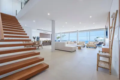 a staircase in a house with a living room at Villa Rada, by Pausa Holiday Rentals in Estreito da Calheta