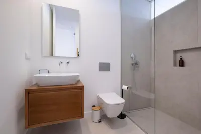 a bathroom with a sink and a toilet and a shower at Villa Rada, by Pausa Holiday Rentals in Estreito da Calheta