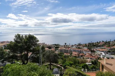 a view of a city and the ocean at Blue Horizon Apartment by An Island Apart in Caniço