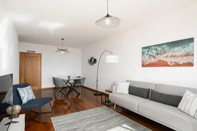 a living room with a couch and a table at Blue Horizon Apartment by An Island Apart in Caniço