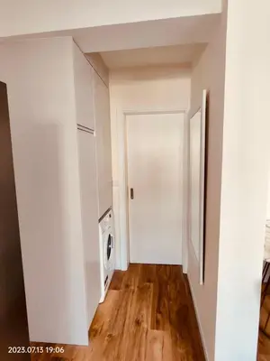 a hallway with white walls and a white door at Apartment with Mountain View in Funchal