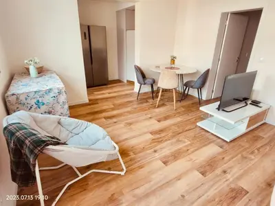 a living room with a table with a laptop and chairs at Apartment with Mountain View in Funchal