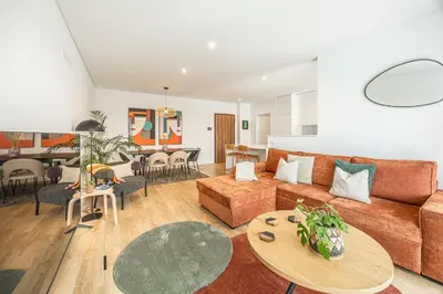 a living room with a couch and a table at Sunny Luxury Apartment Canico in Caniço