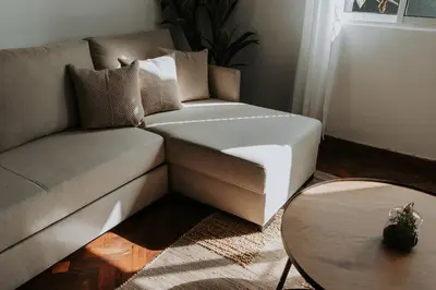 a living room with a couch and a table at Serenity Sao Roque 2 Bedroom House in Funchal with Parking in Funchal