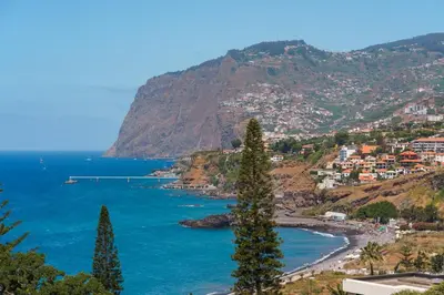 a view of a beach and the ocean at GuestReady - Bright home with stunning views in Funchal