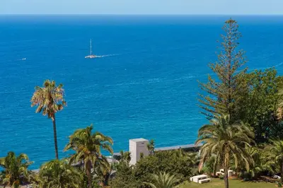 a view of the ocean with a boat in the distance at GuestReady - Bright home with stunning views in Funchal