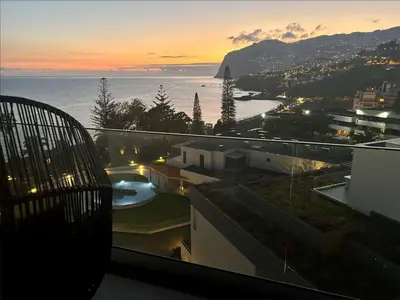 a view of the ocean from a balcony of a building at GuestReady - Bright home with stunning views in Funchal